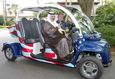 President George W. Bush drives new Iraqi President Ghazi Ajil al-Yawer in a GEM (Global Electric Motor) vehicle at the G-8 Summit, Sea Island, Georgia, June 9, 2004.